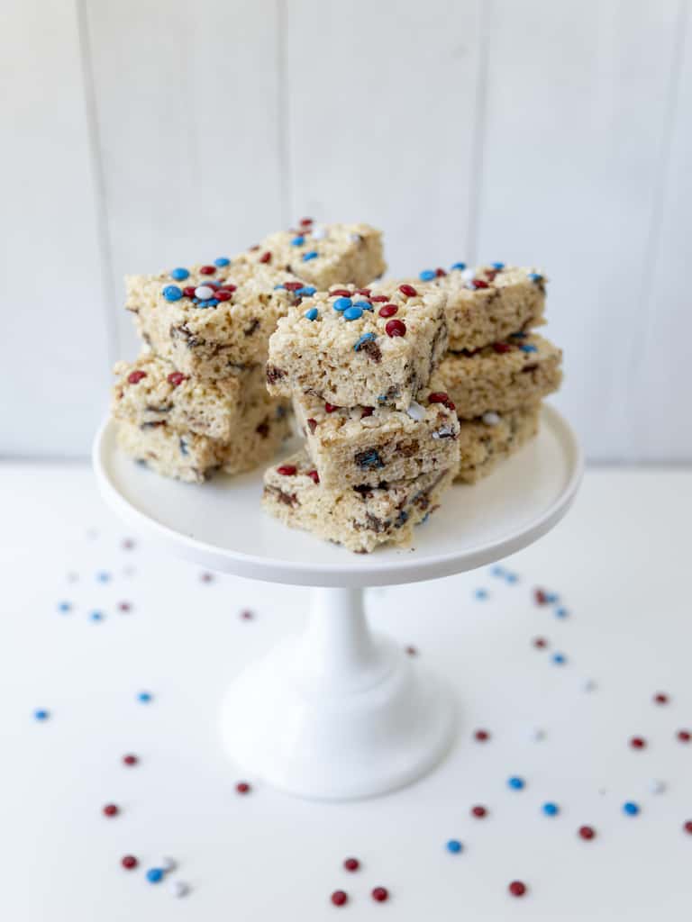 the finished instant pot rice krispie treat recipe stacked and served on a white cake stand
