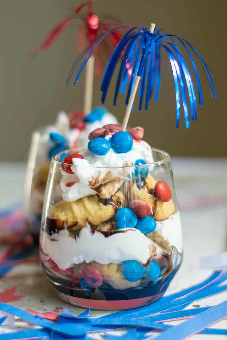 red white and blue trifle served in glass jars