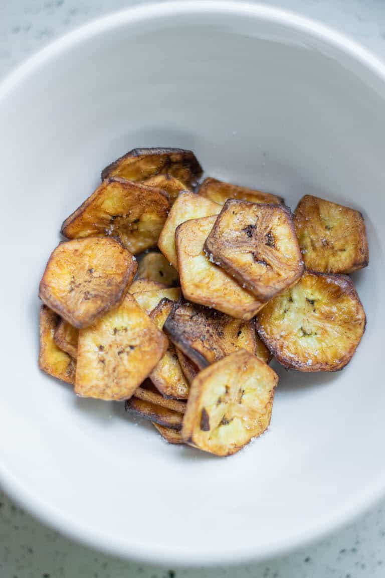 air fryer banana chips served in a white bowl