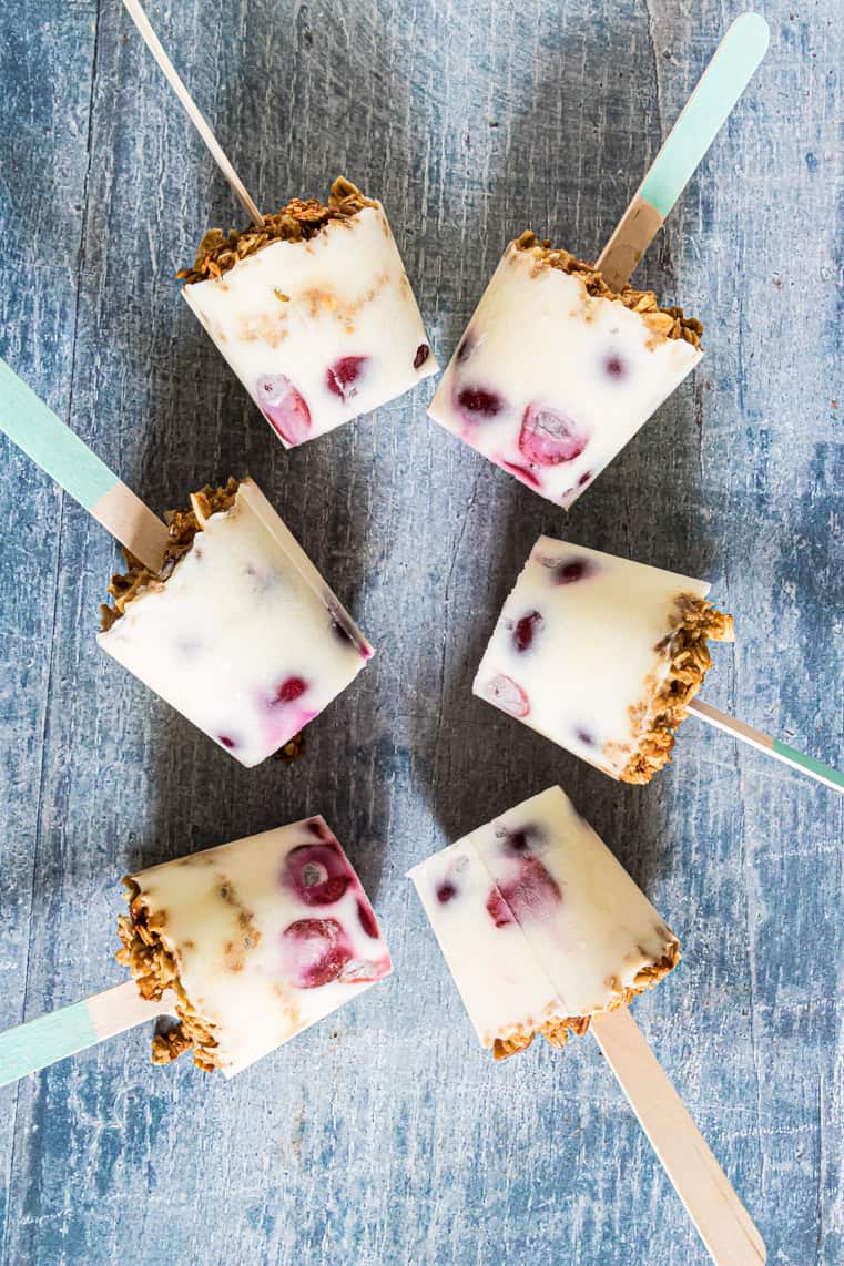 six completed cherry yogurt popsicles