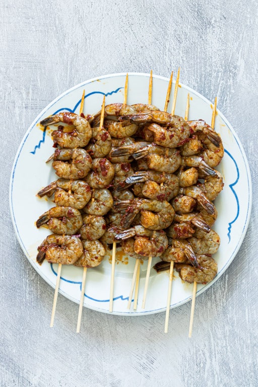 marinated grilled shrimp skewers ready to be cooked