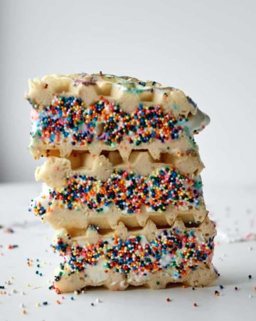 a stack of three waffle ice cream sandwich