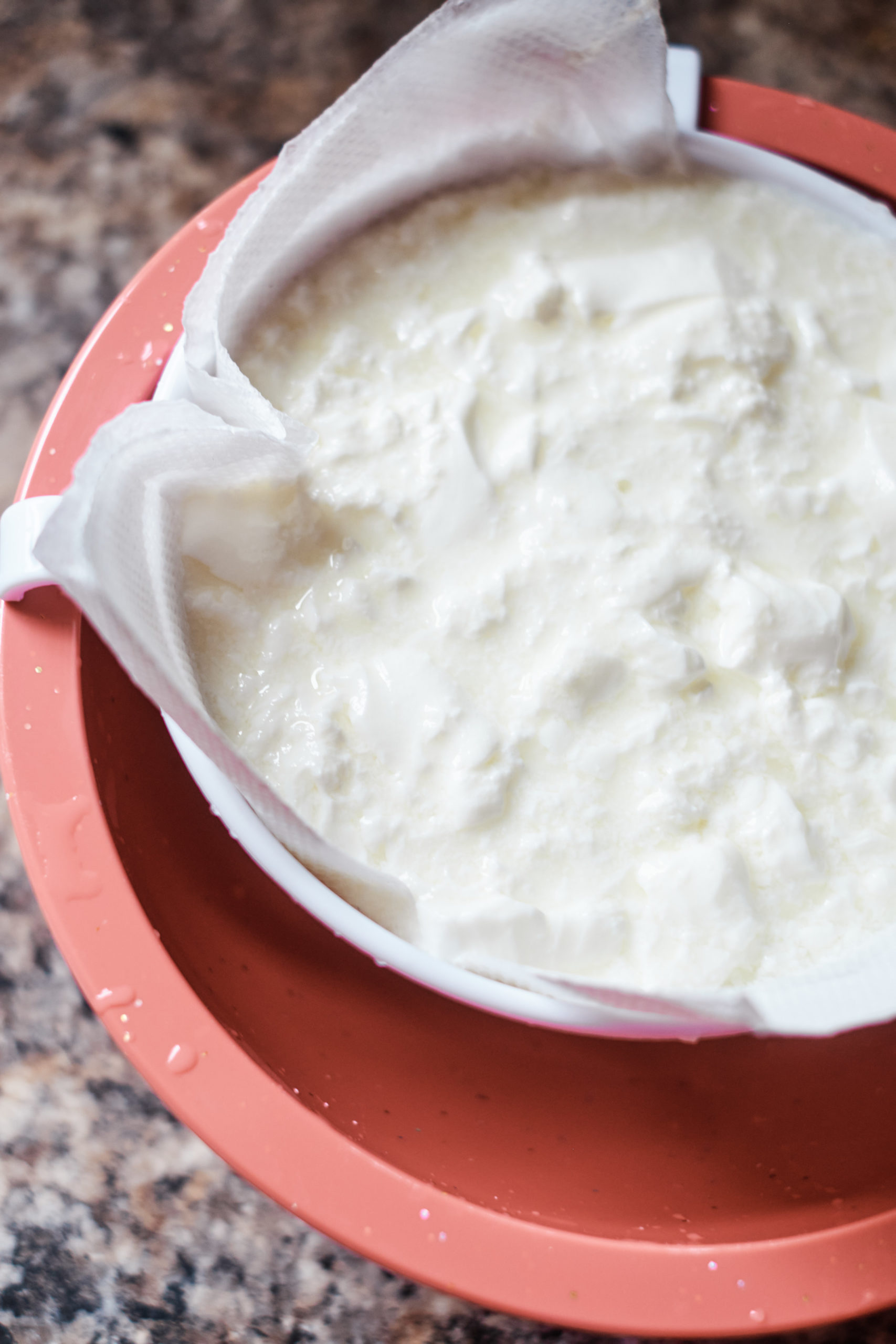 the process of straining instant pot yogurt to make instant pot greek yogurt