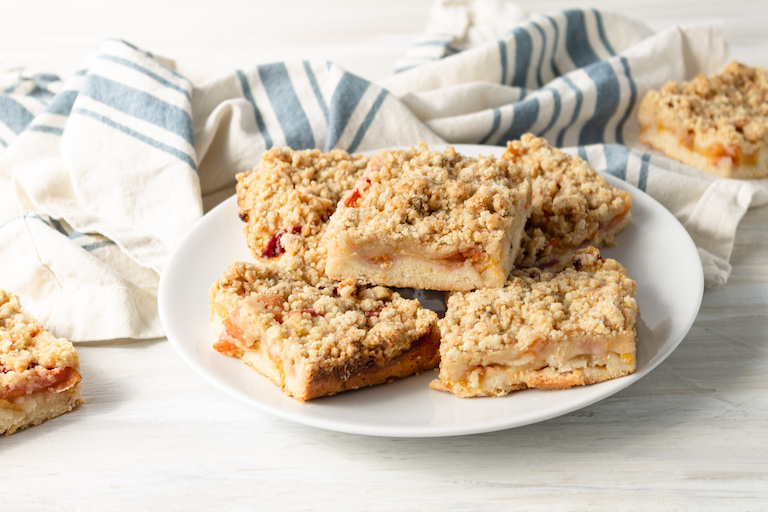 a plate if the finished peach crumb bars recipe