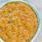 close up view of a bowl filled with instant pot mango chutney