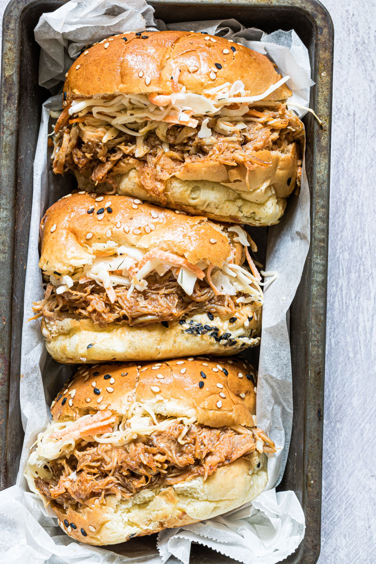 three instant pot pulled chicken sandwiches served in a tray