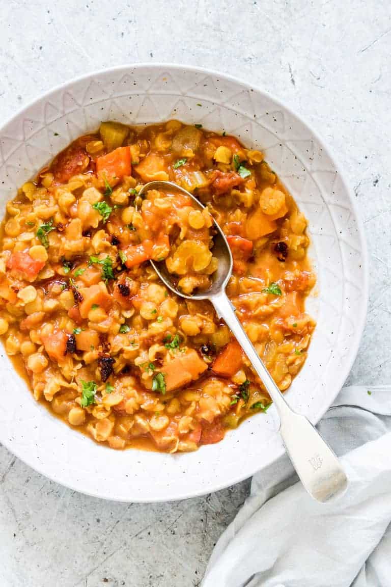 overhead view of instant pot split pea soup with a spoon sticking out of the soup