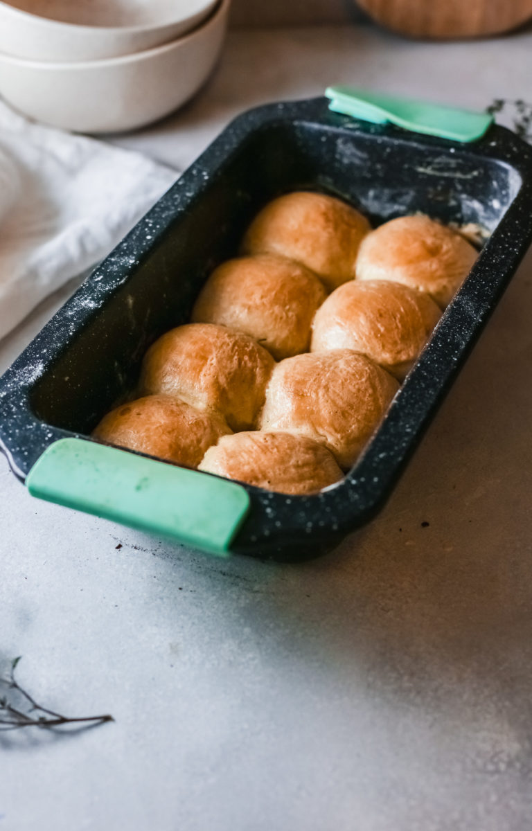 the completed instant pot dinner rolls inside a baking dish
