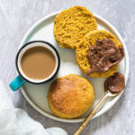 two air fryer biscuits served with pumpkin butter and a cup of coffee
