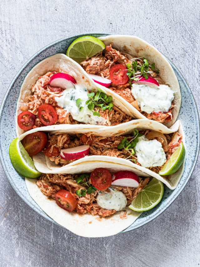 Crockpot chicken fajitas in a bowl with filling.