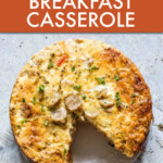 round breakfast casserole with a slice taken out of it.