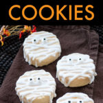 a row of 5 mummy cookies on a napkin