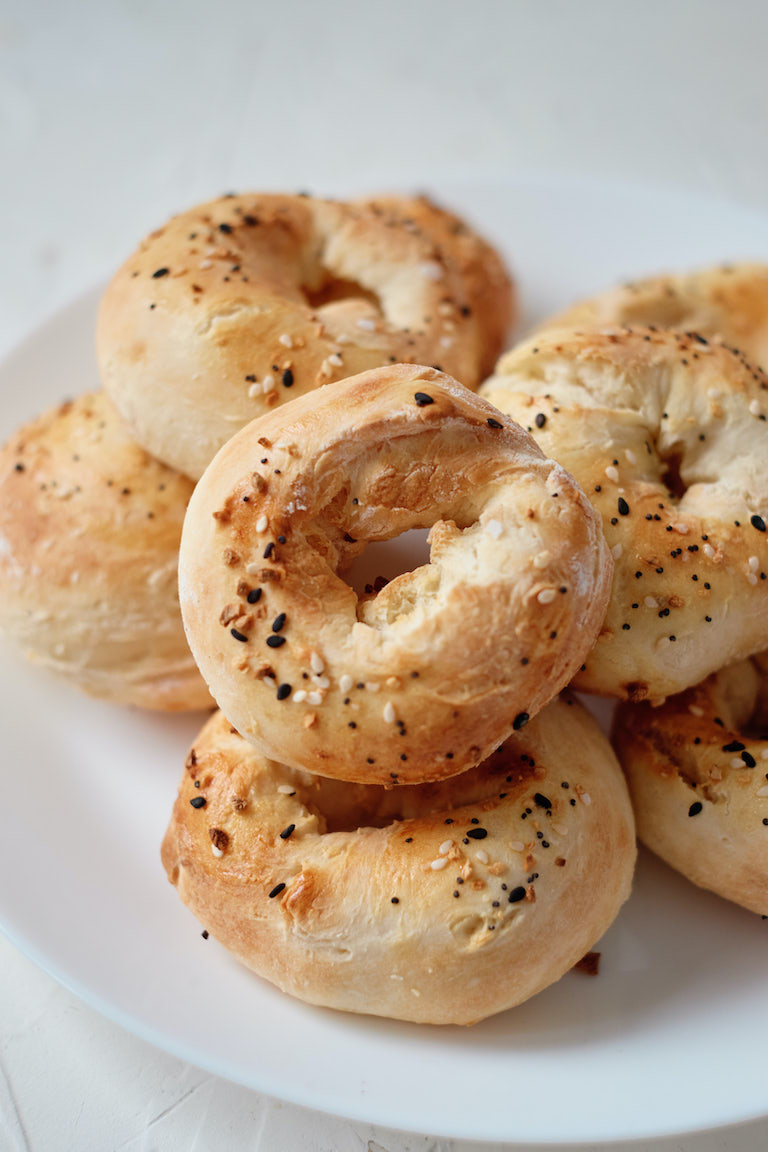 the completed air fryer bagels served on a white plate