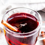 a glass filled with spiced wine