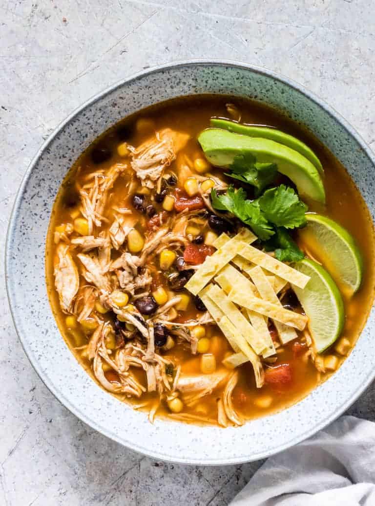 Instant Pot Chicken Tortilla Soup in a white spotted plate.