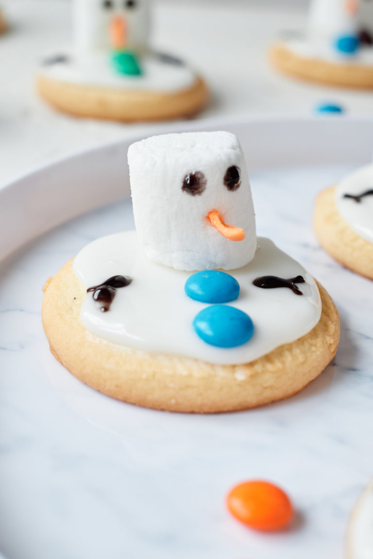 close up view of a finished melting snowman cookie