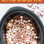 Top down view of hot chocolate and marshmallows in a crock pot