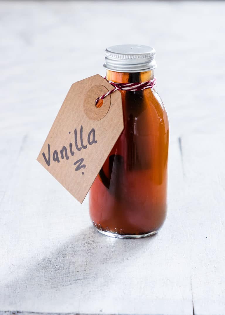 Completed Instant Pot Vanilla Extract in a small bottle and tied with a handwritten gift tag