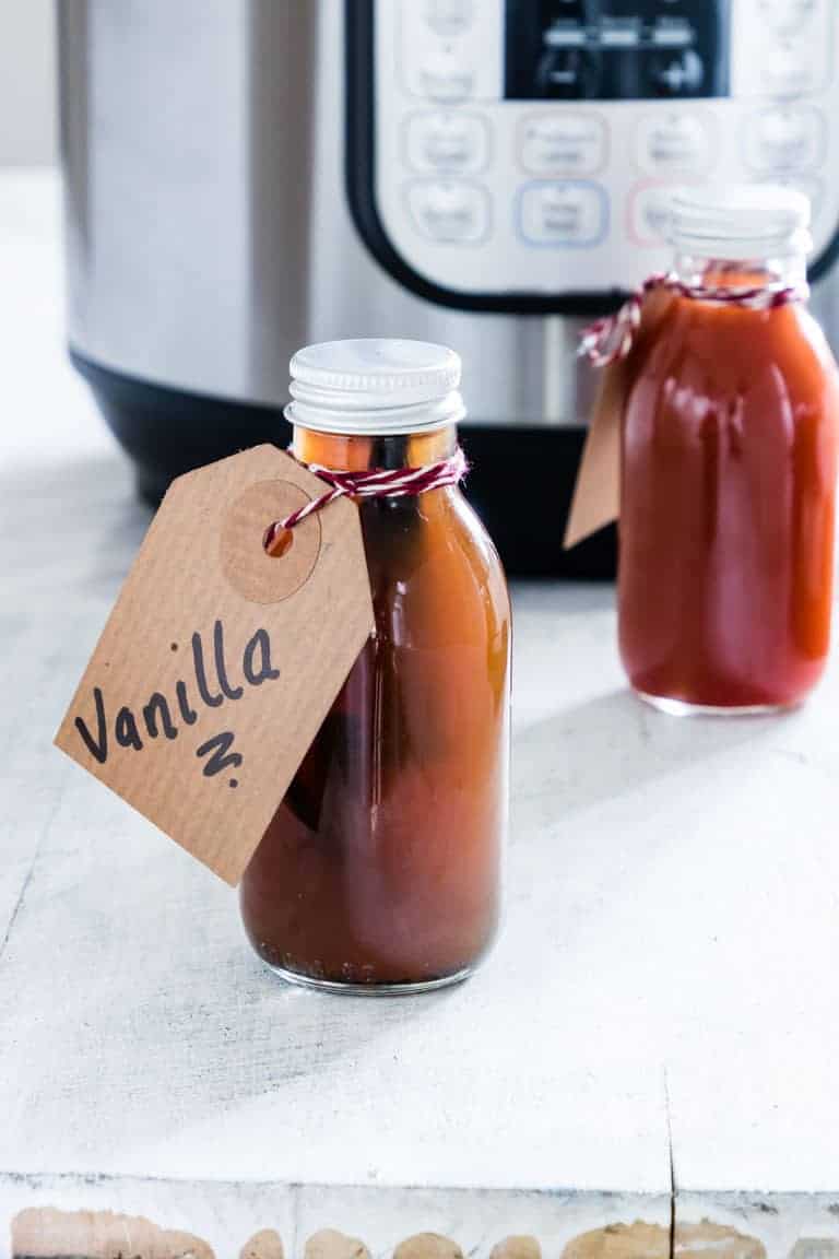 The completed Instant Pot Vanilla Extract packed in individual bottled and tied with handwritten gift tags