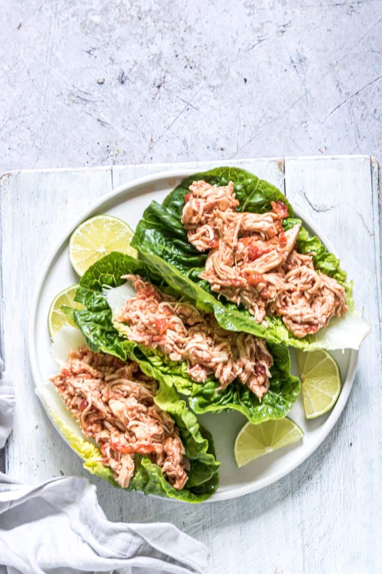 three salsa chicken lettuce wraps on a white plate