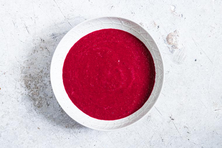 beetroot soup in a white bowl