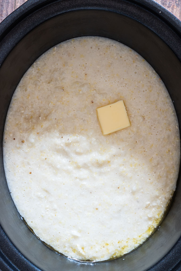 cooked grits inside the slow cooker