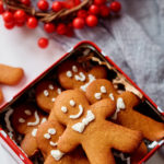 gingerbread man cookies inside a holiday tin