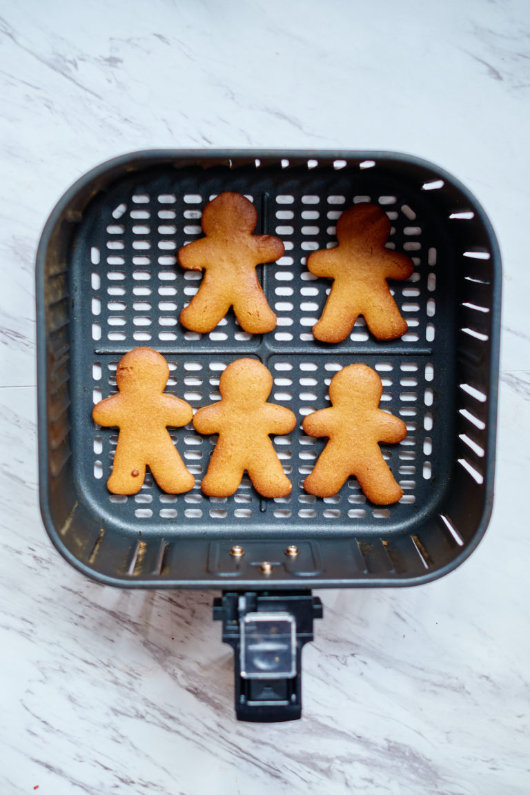top down view of the baked gingerbread cookies in the air fryer basket