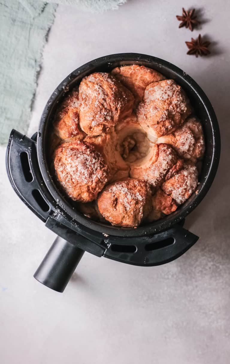 top down view of the cooked monkey bread inside the air fryer basket