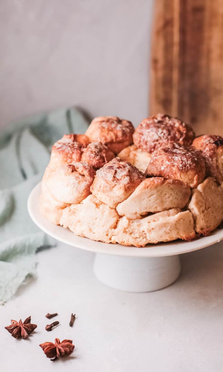 the finished pull apart bread served on a white cake stand