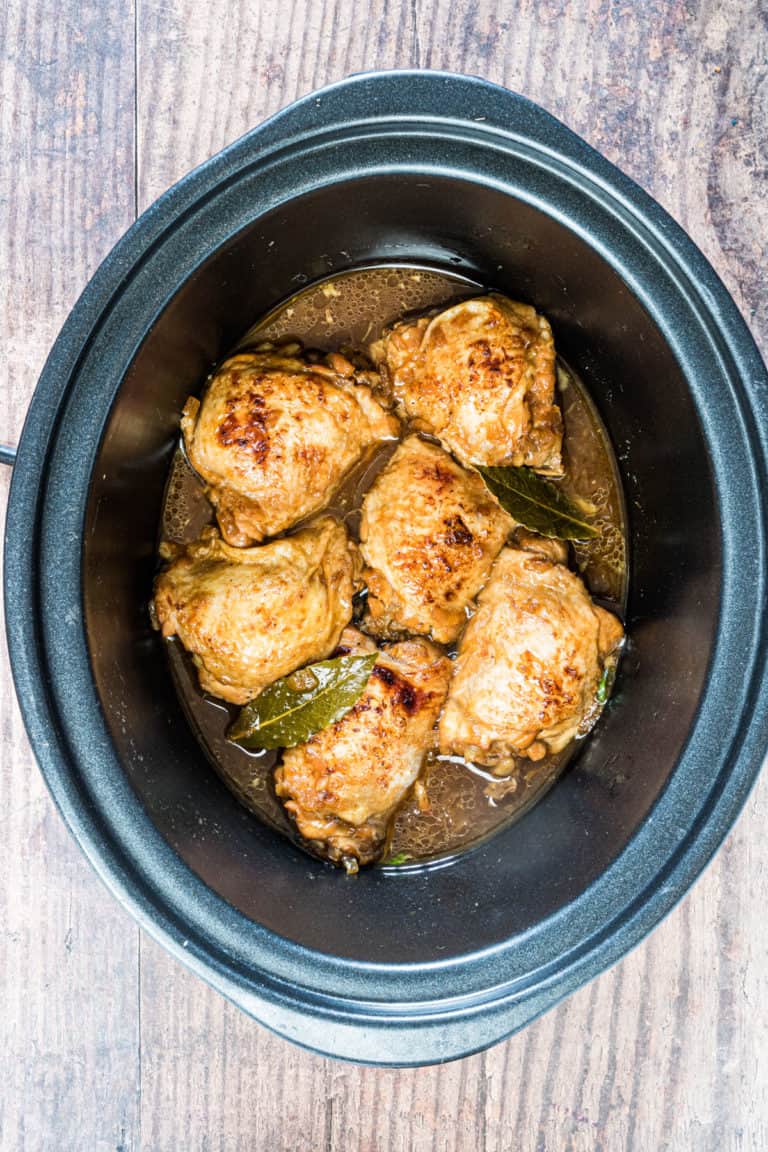 the completed adobo chicken inside the slow cooker