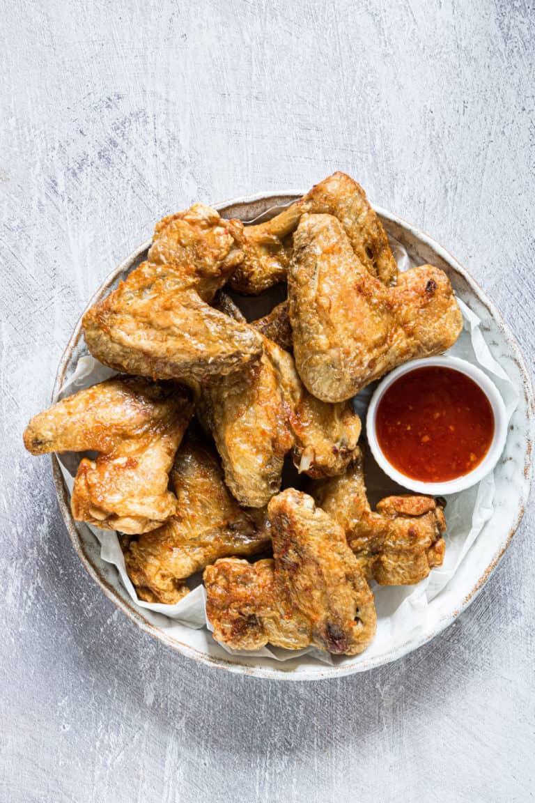 a plate filled with the finished air fryer frozen chicken wings