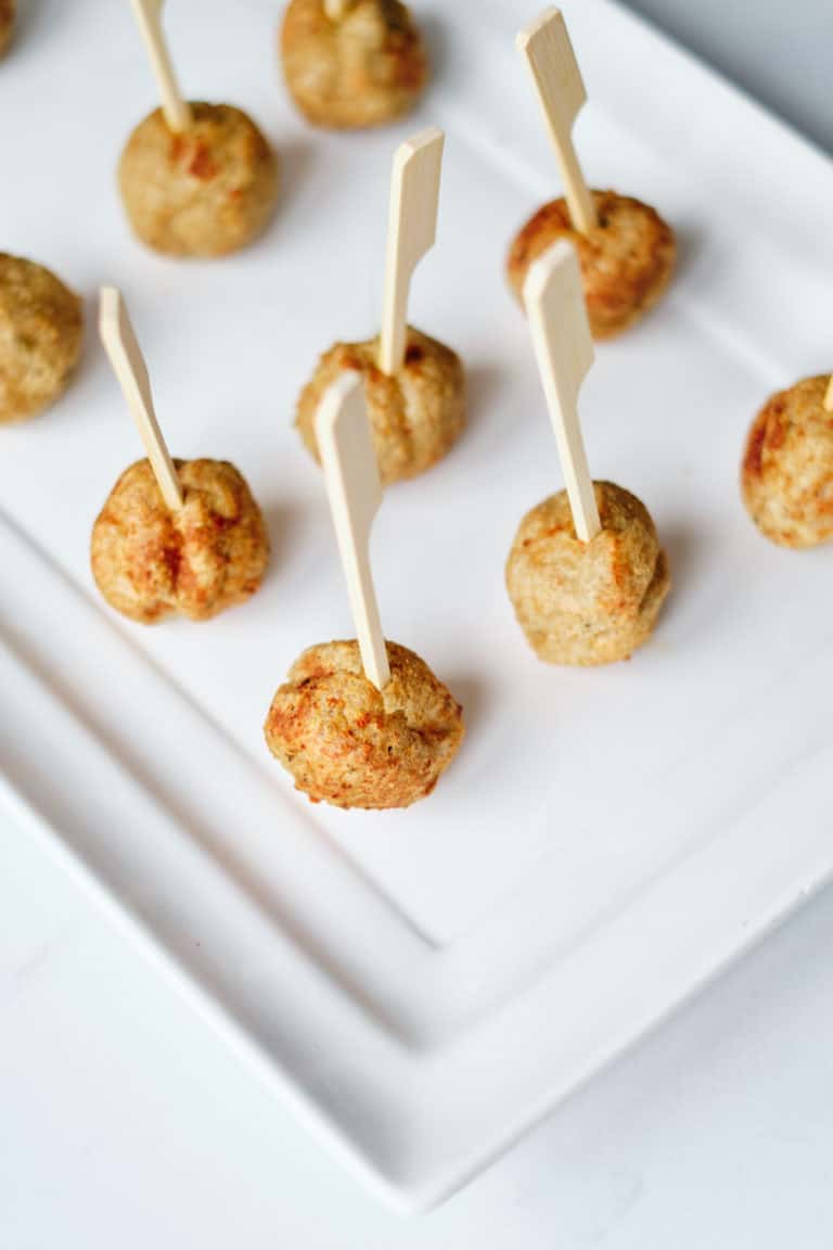 the completed frozen meatballs served with toothpicks on a white platter