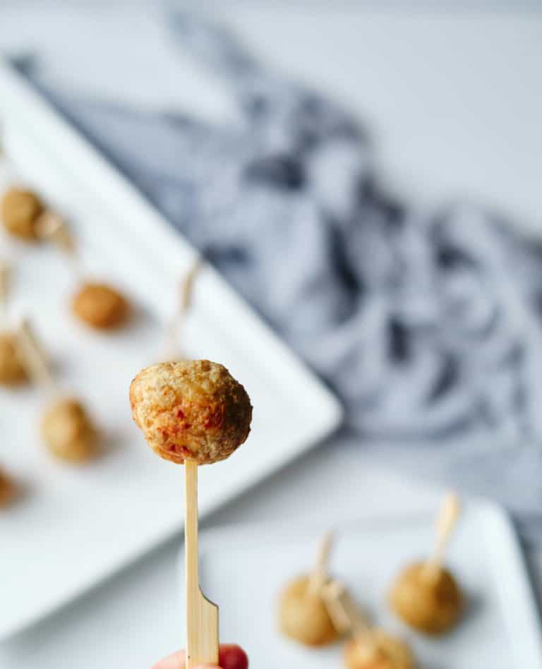 close up view of one meatball on a toothpick
