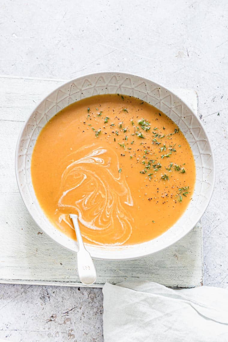 a bowl filled with jamaican pumpkin soup
