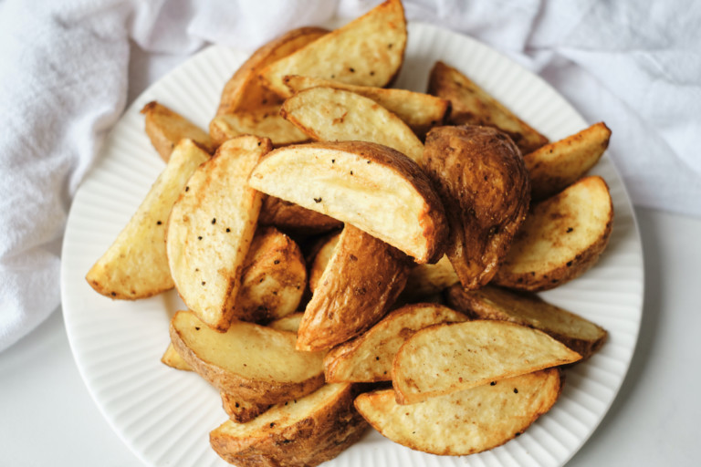 a plate of air fryer potato wedges ready to be served