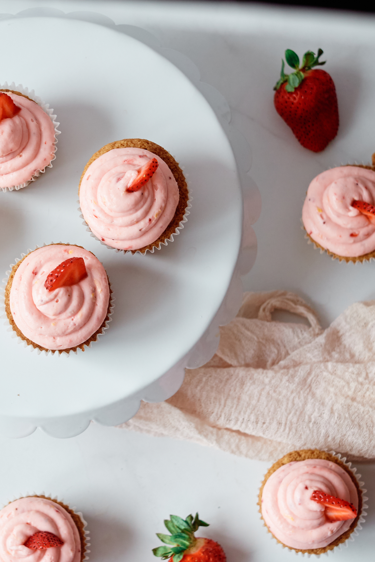 top down view of the completed churro cupcakes with strawberry frosting