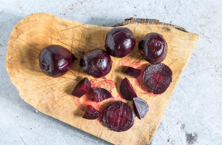 Sliced Cooked beetroot on a chopping board