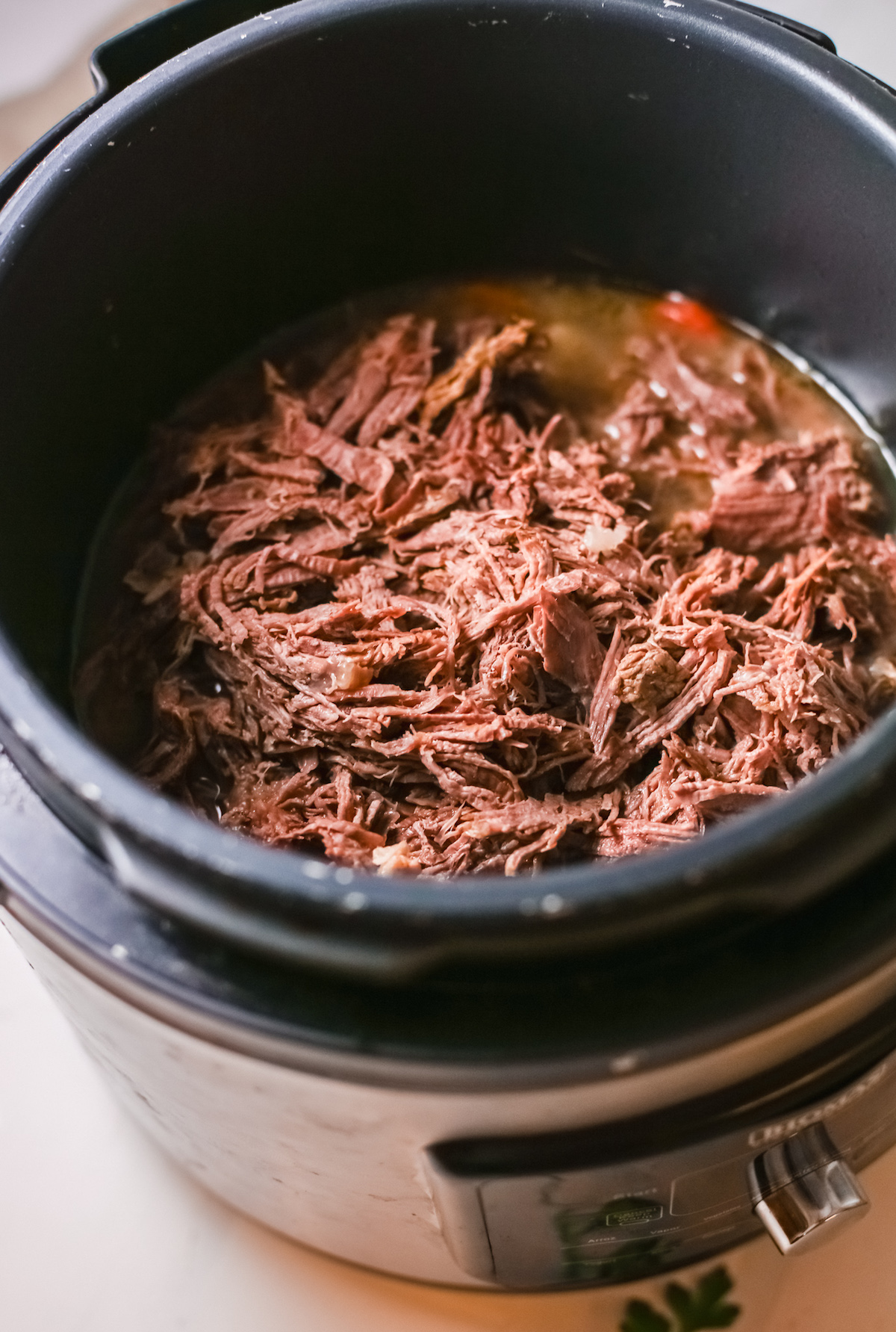 the finished barbacoa beef inside the instant pot