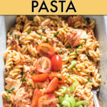 BAKED FETA PASTA IN A CASSEROLE DISH GARNISHED WITH TOMATOES