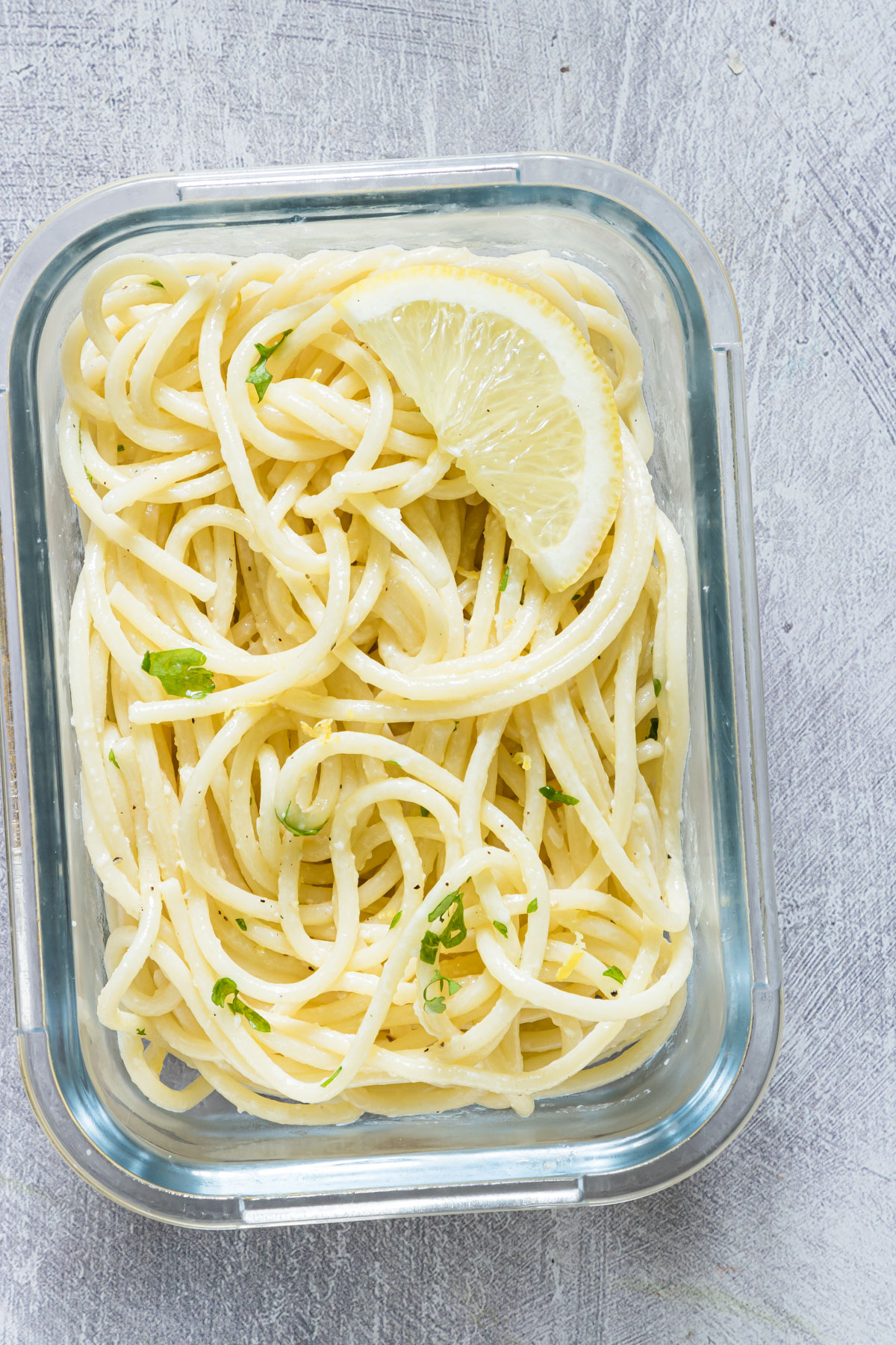 a meal prep bowl of lemon spaghetti