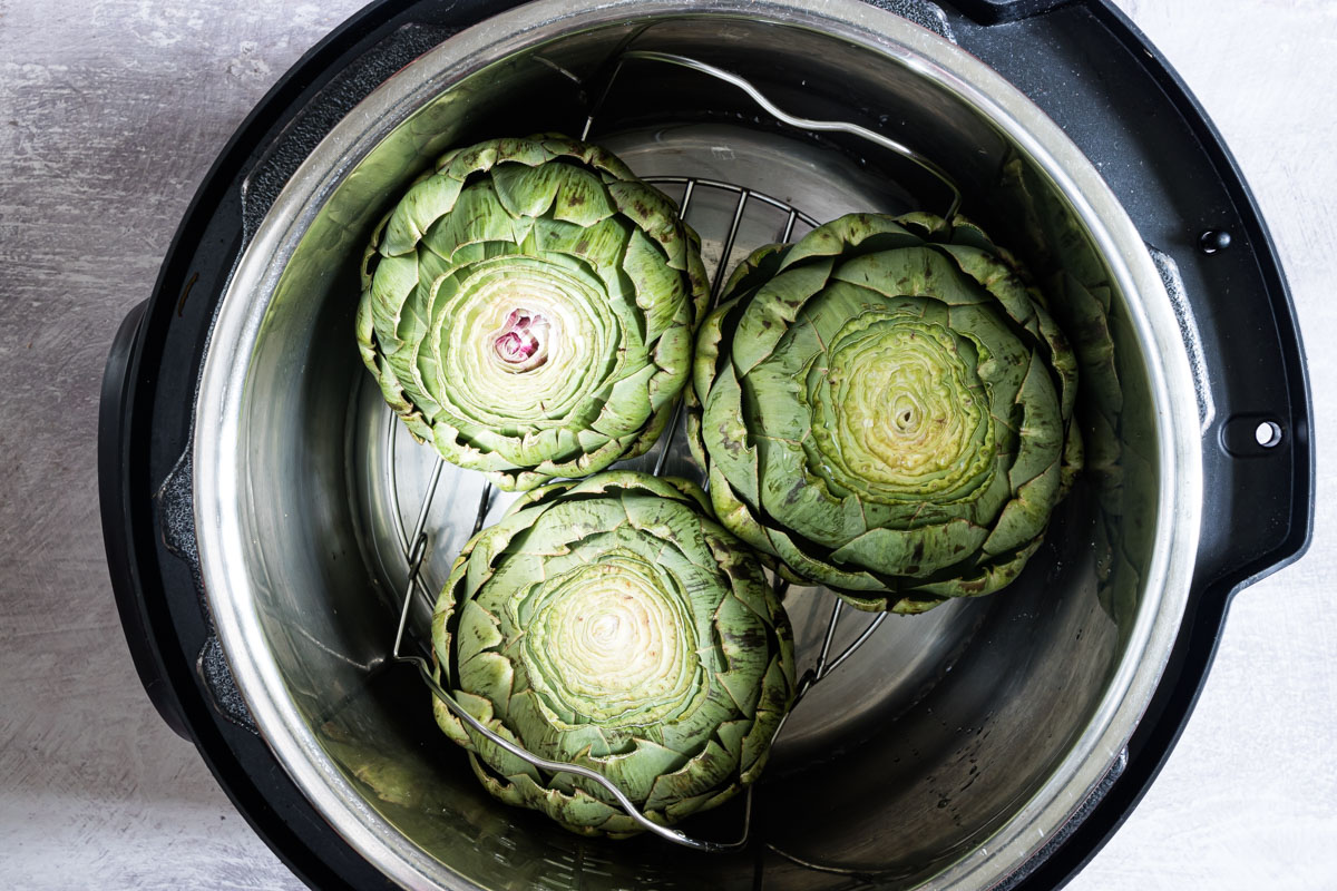 3 uncooked artichokes in an instant pot