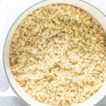 a white saucepan full of cooked quinoa