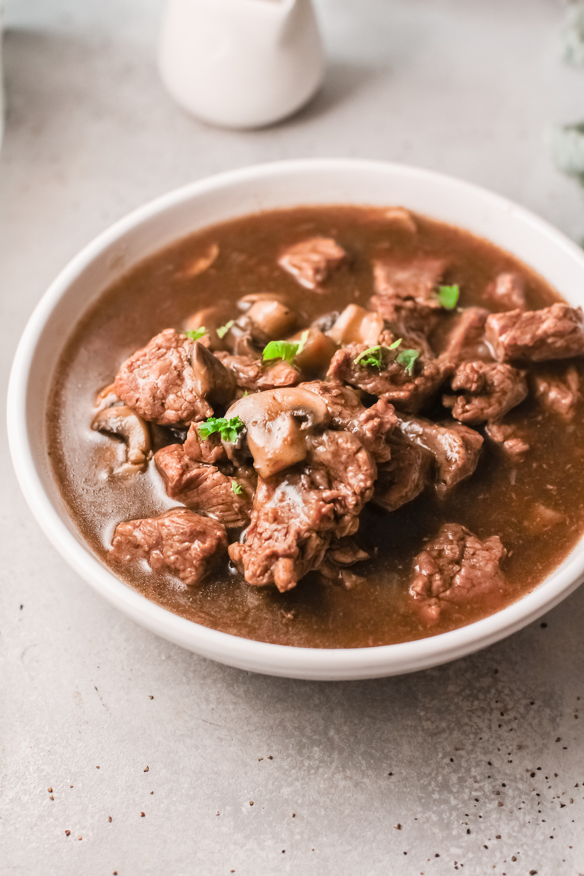 a bowl filled with the completed instant pot beef tips and gravy recipe