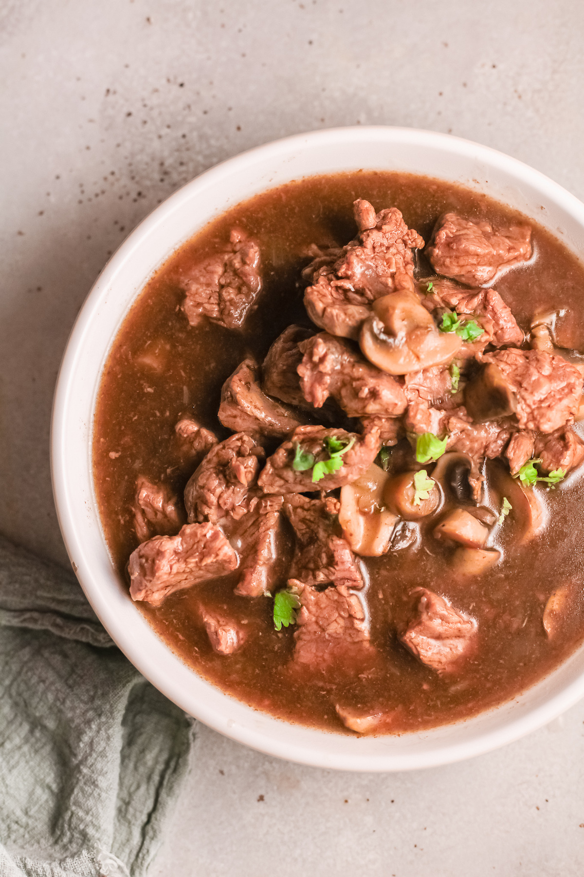 the completed Instant Pot Beef Tips served in a ceramic bowl