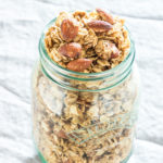 mason jar of cooked almond granola on a table