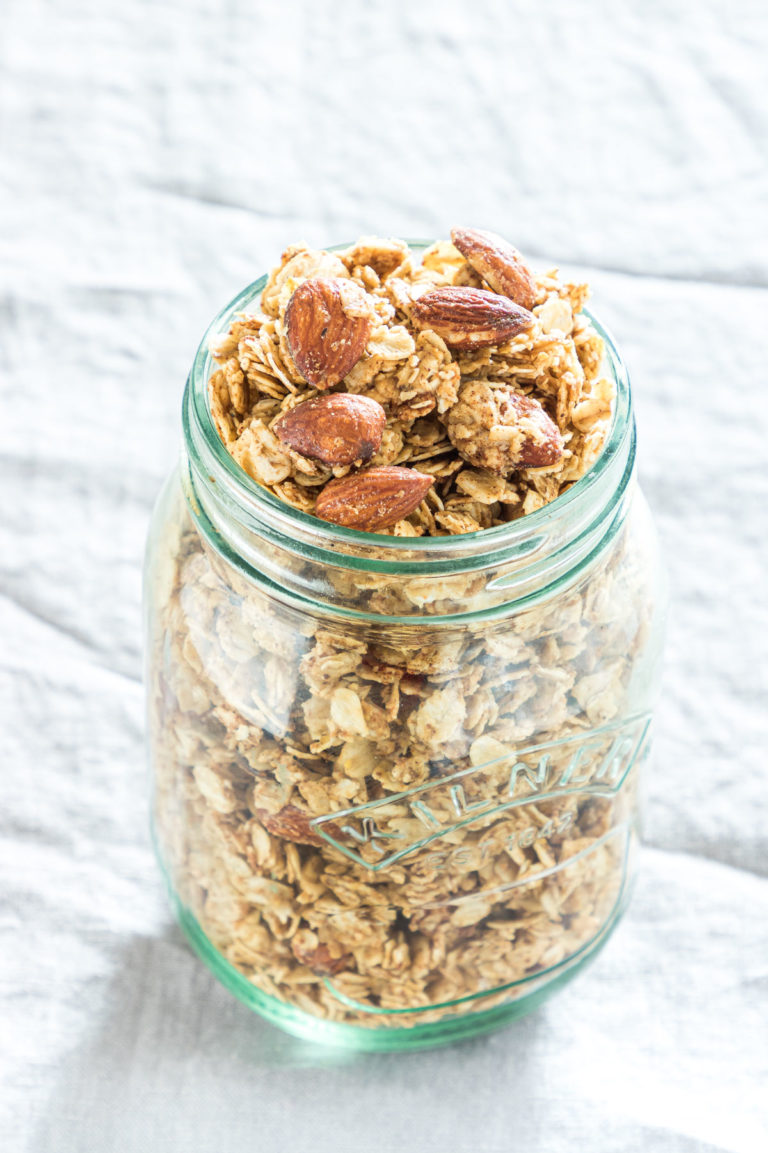 mason jar of cooked almond granola on a table