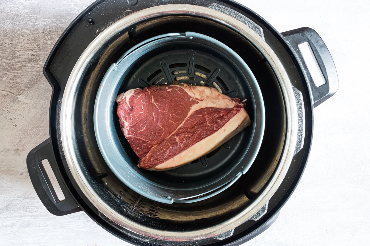 top down view of steak inside instant pot