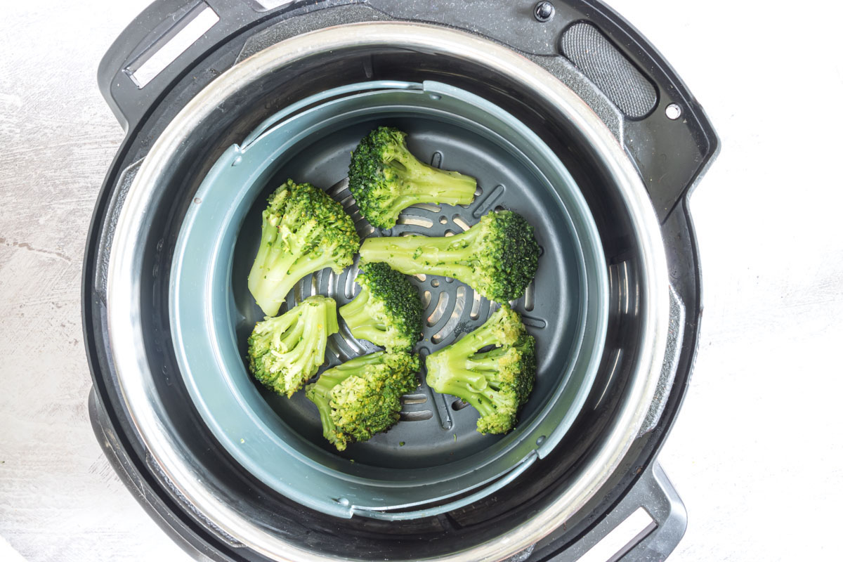 frozen broccoli inside the instant pot air fryer basket