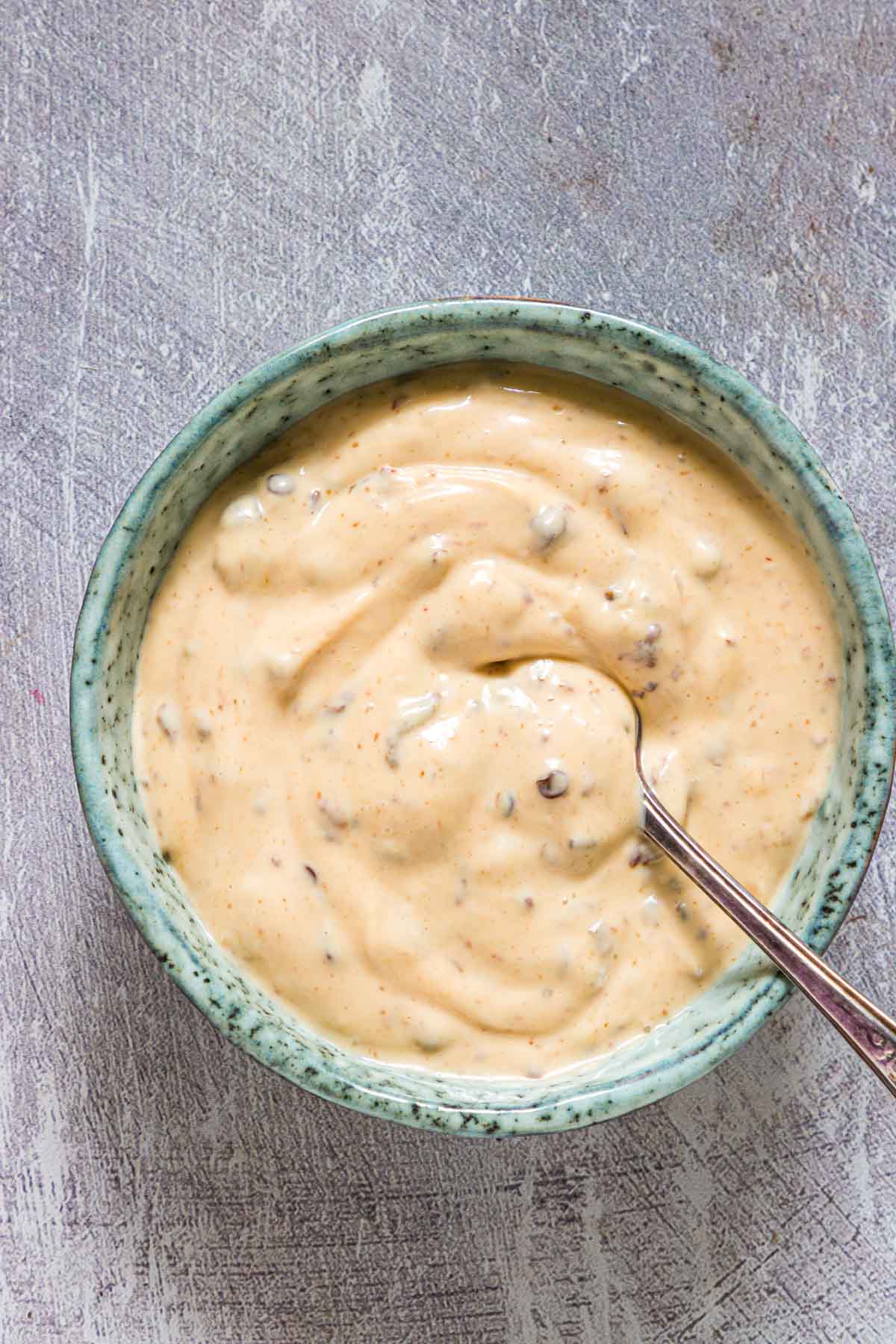 top down view of a bowl filled with the completed chipotle aioli recipe